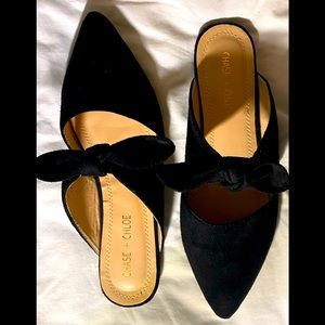 Beautiful new Chase and Chloe black suede flats with a bow on top.EC